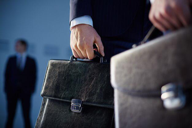 A federal criminal lawyer carrying a briefcase